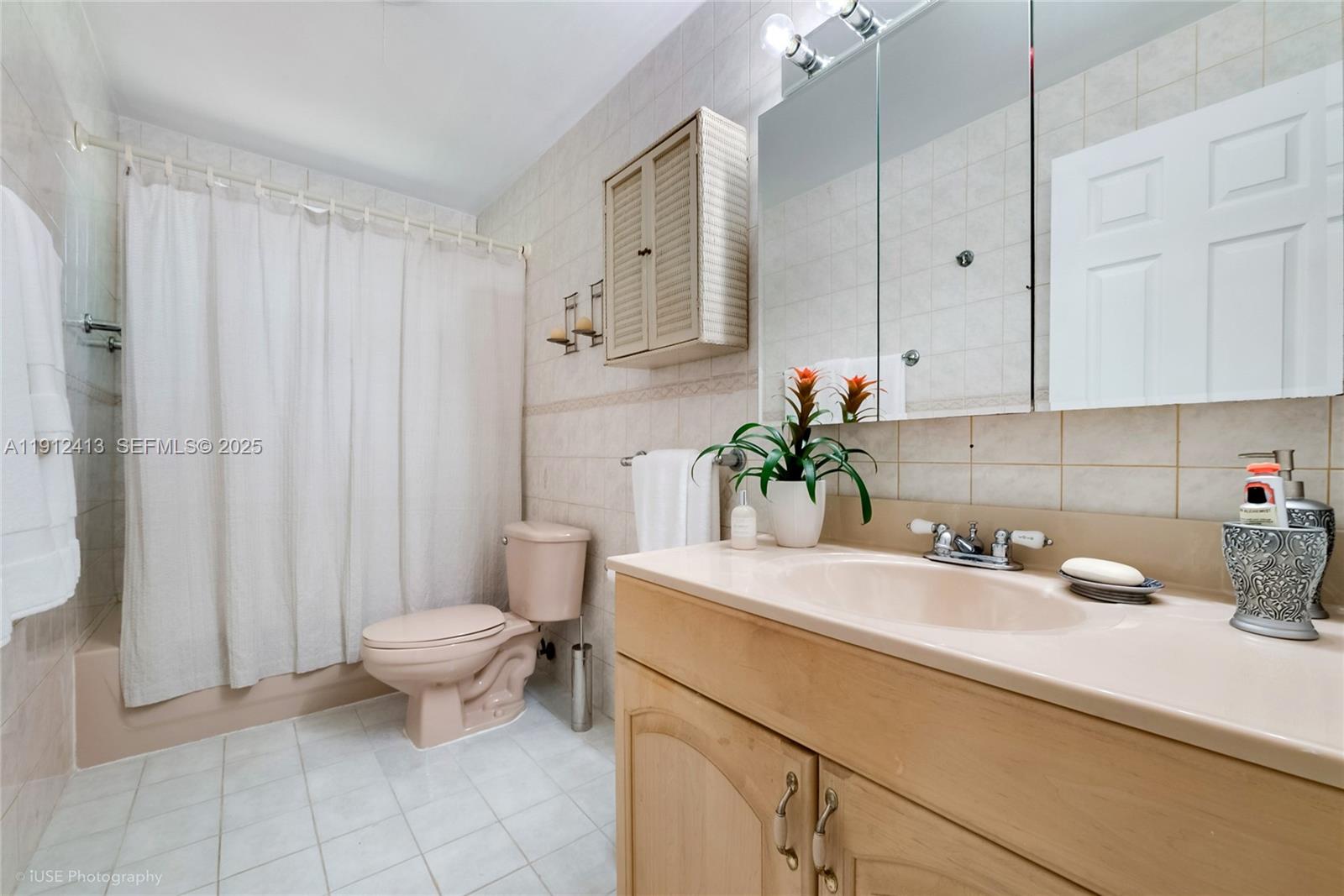 4235 Southwest 97th Avenue Miami, FL 33165 - Photo 14 of 21 a bathroom with a sink toilet and shower