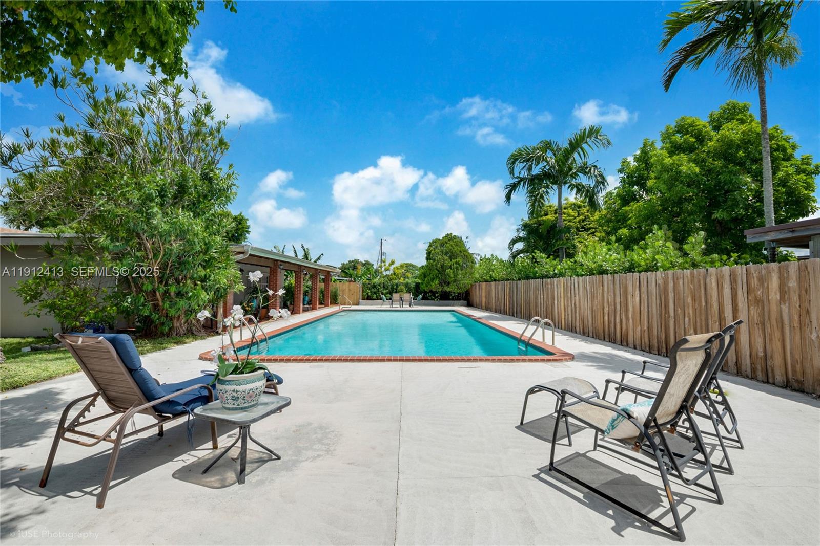 4235 Southwest 97th Avenue Miami, FL 33165 - Photo 15 of 21 a swimming pool with outdoor seating and yard