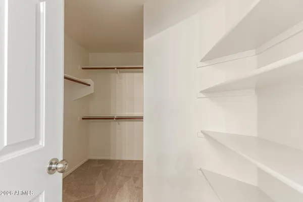 a view of an empty walk in closet