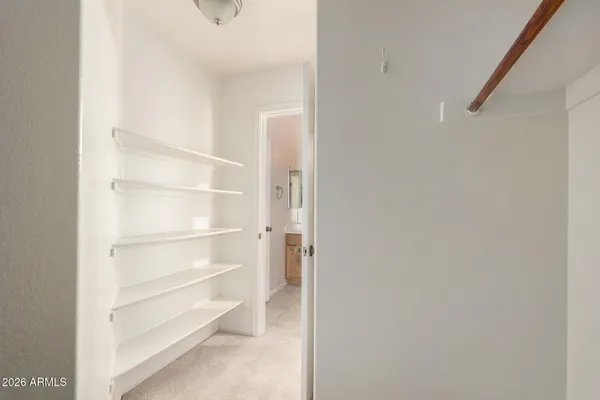a view of an empty walk in closet