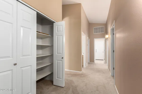 a view of closet area with empty racks