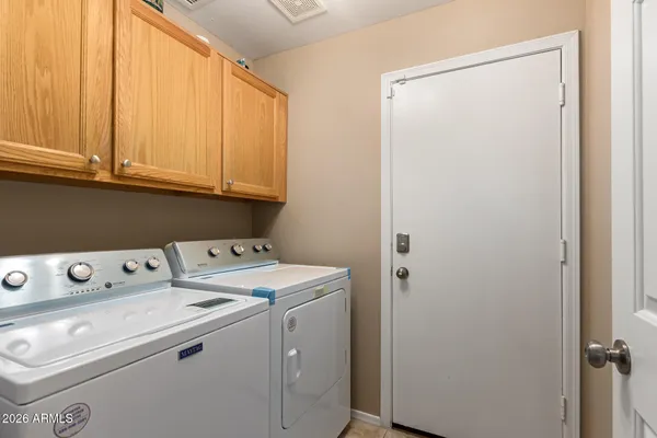 a utility room with dryer and washer