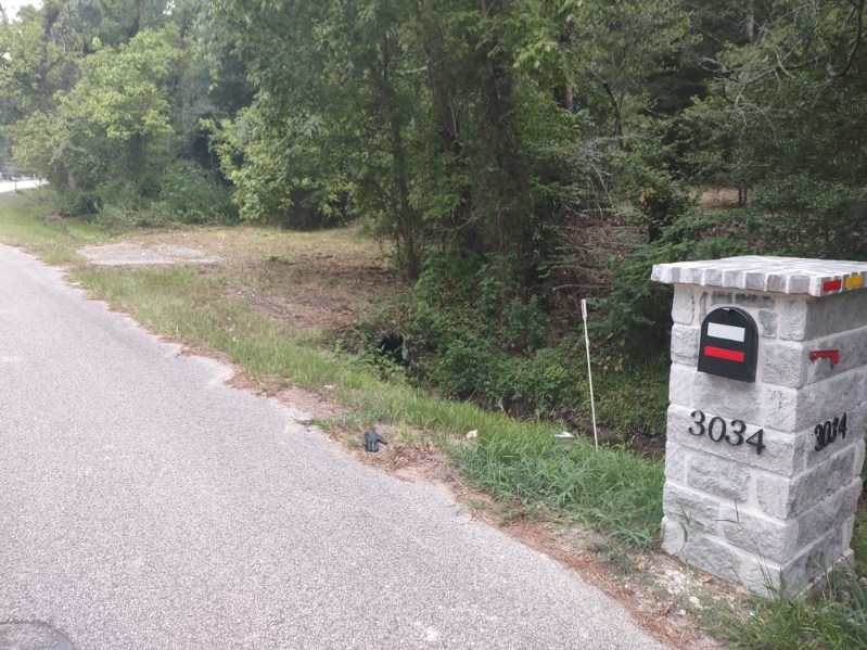 3035 Old Colony Road Huntsville, TX 77320 - Photo 7 of 7 a sign that is on the side of the road