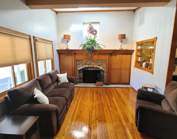 a living room with furniture and a window