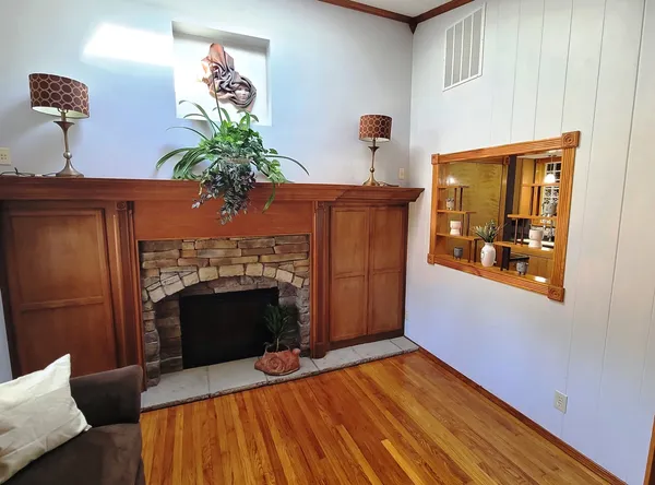 a view of a livingroom with furniture and a window