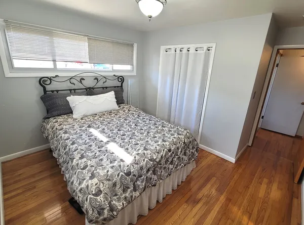 a front view of a house with yard patio and lake view