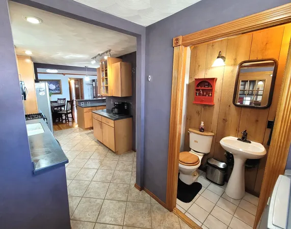 a kitchen with stainless steel appliances a sink stove and cabinets