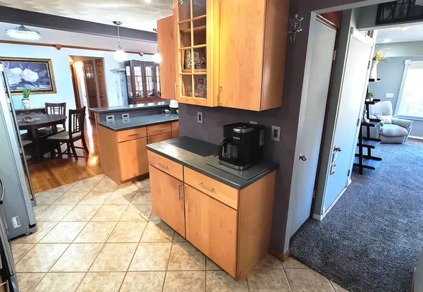 a kitchen with stainless steel appliances a refrigerator sink and cabinets