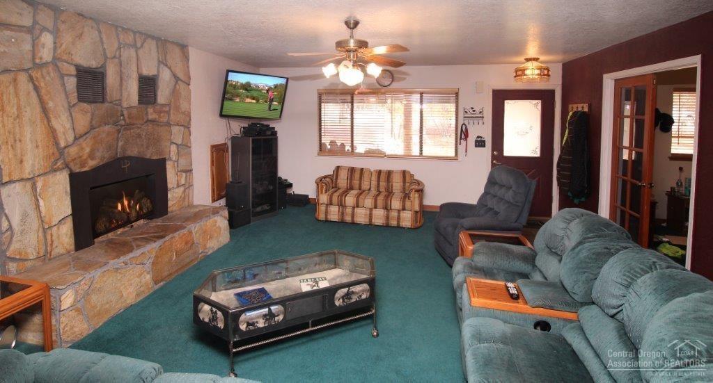 10473 Southwest Cornett Loop Powell Butte, OR 97753 - Photo 2 of 24 Living room with fireplace
