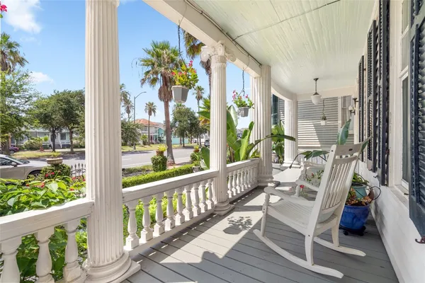 a view of balcony with furniture