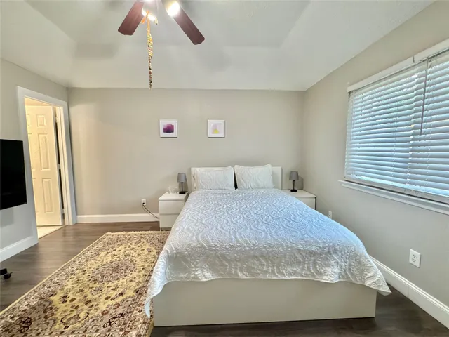 a bathroom with a double vanity sink toilet mirror and shower
