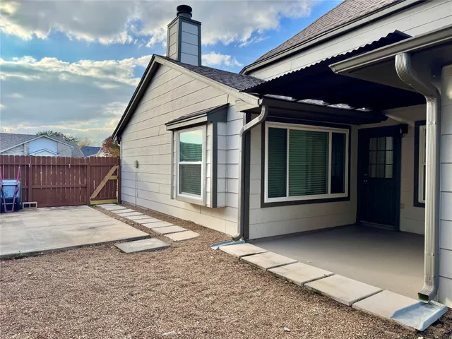 a view of backyard with cabin