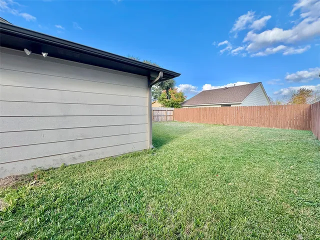 a backyard of a house with lots of green space