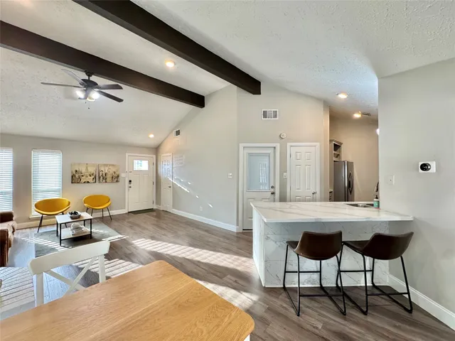 a kitchen with a sink cabinets and appliances