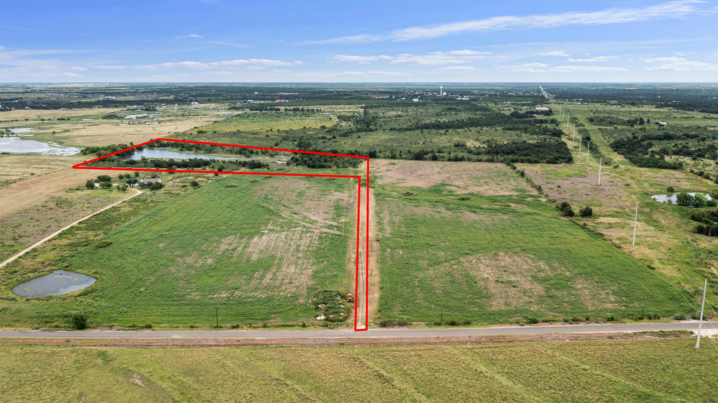 3315 County Road 463 Elgin, TX 78621 - Photo 7 of 32 Scenic acreage with a pond offers a serene backdrop for your future development.