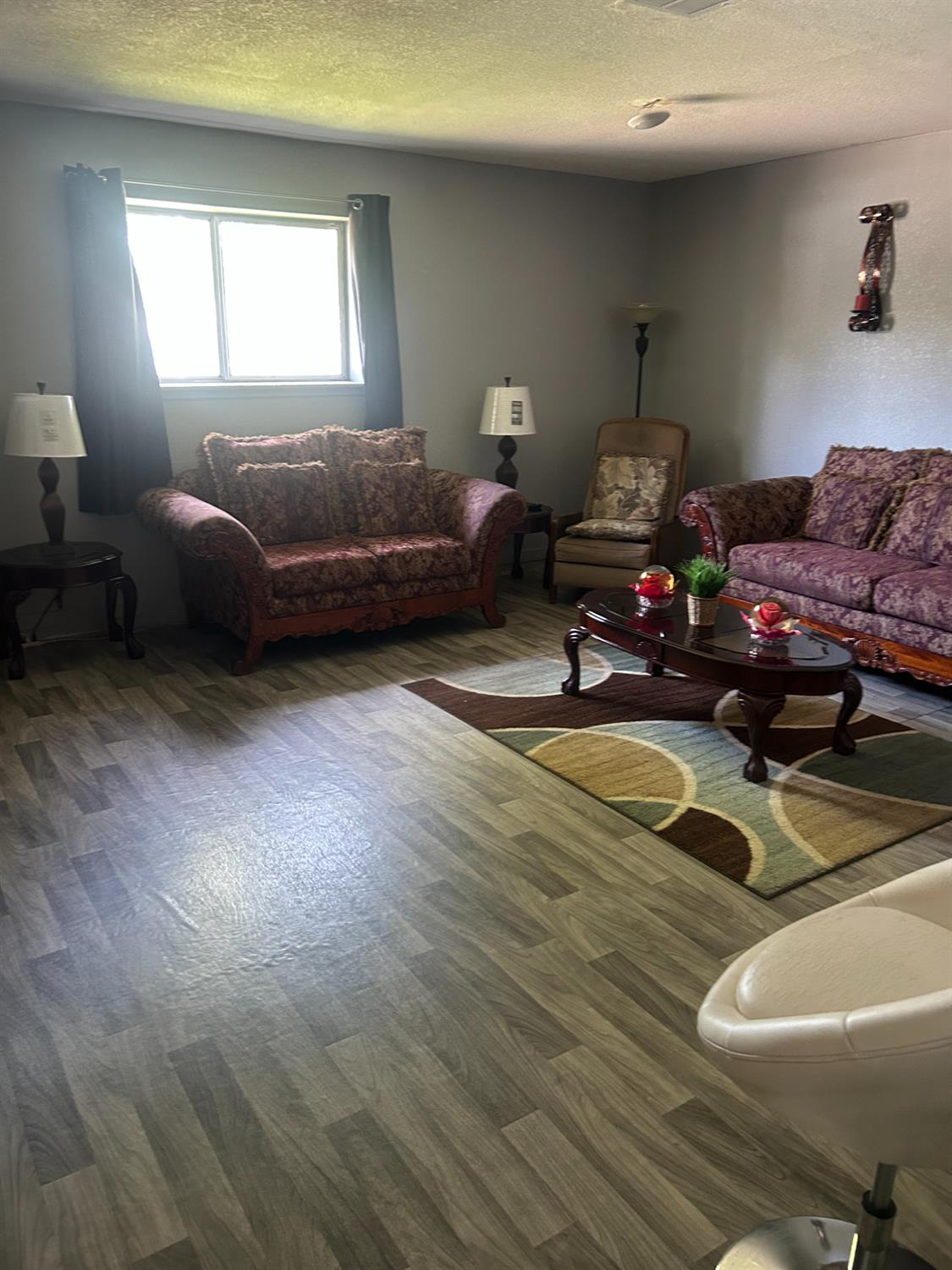 304 North Madison Street Modesto, CA 95351 - Photo 6 of 12 a bedroom with furniture and a window