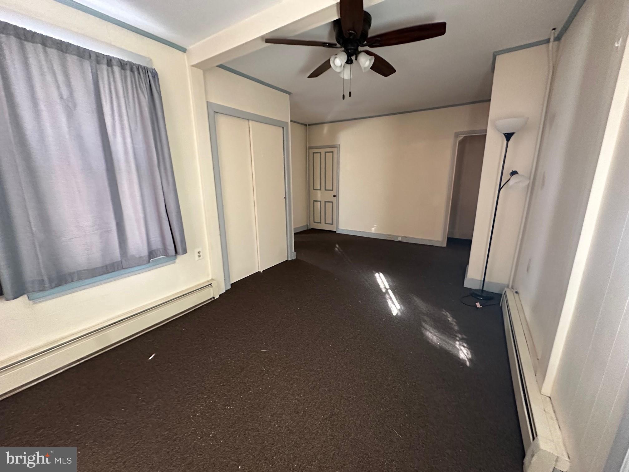 308 A Ash Street Delanco, NJ 08075 - Photo 4 of 11 a view of an empty room with a window