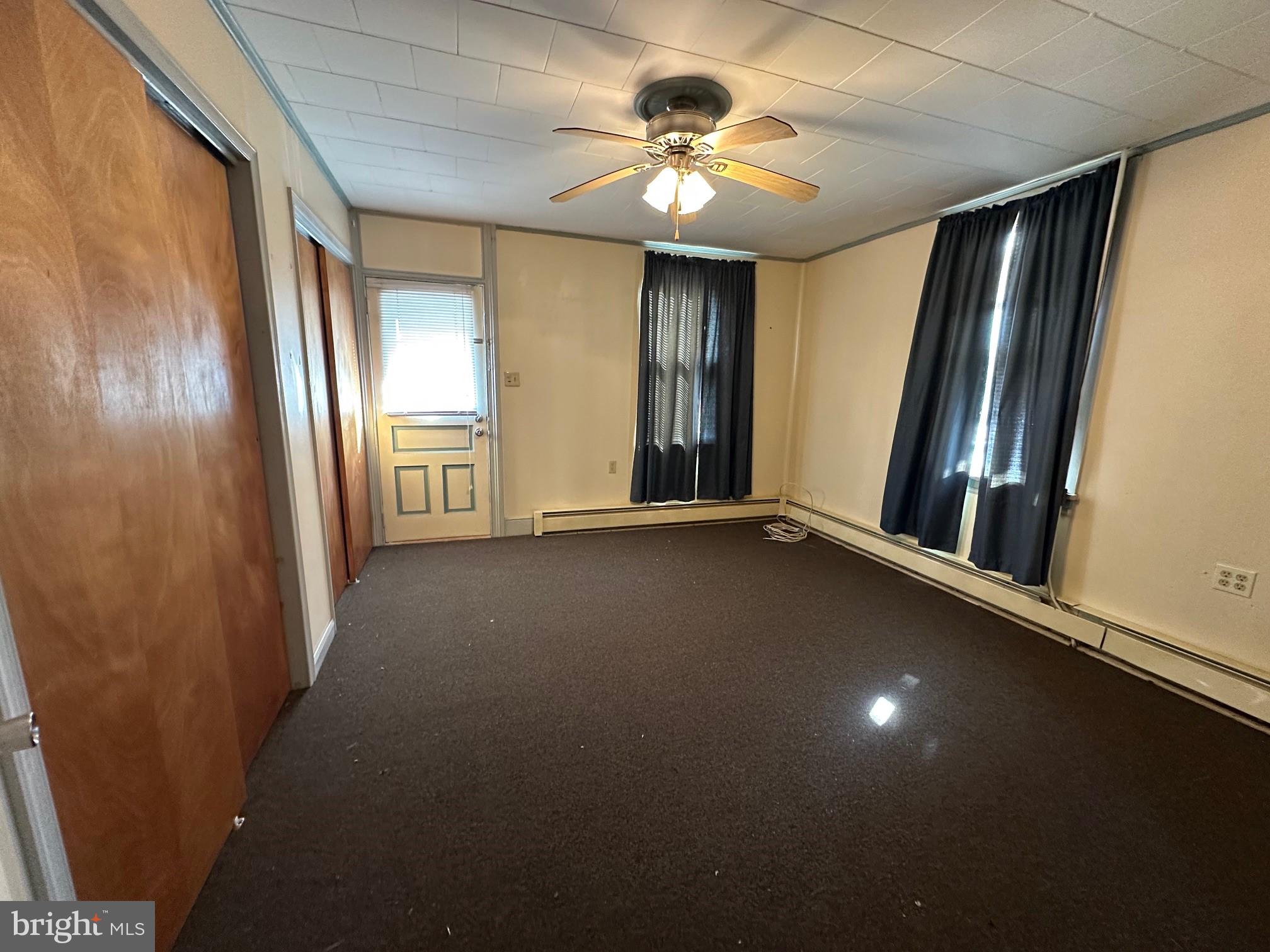 308 A Ash Street Delanco, NJ 08075 - Photo 6 of 11 an empty room with windows and fan