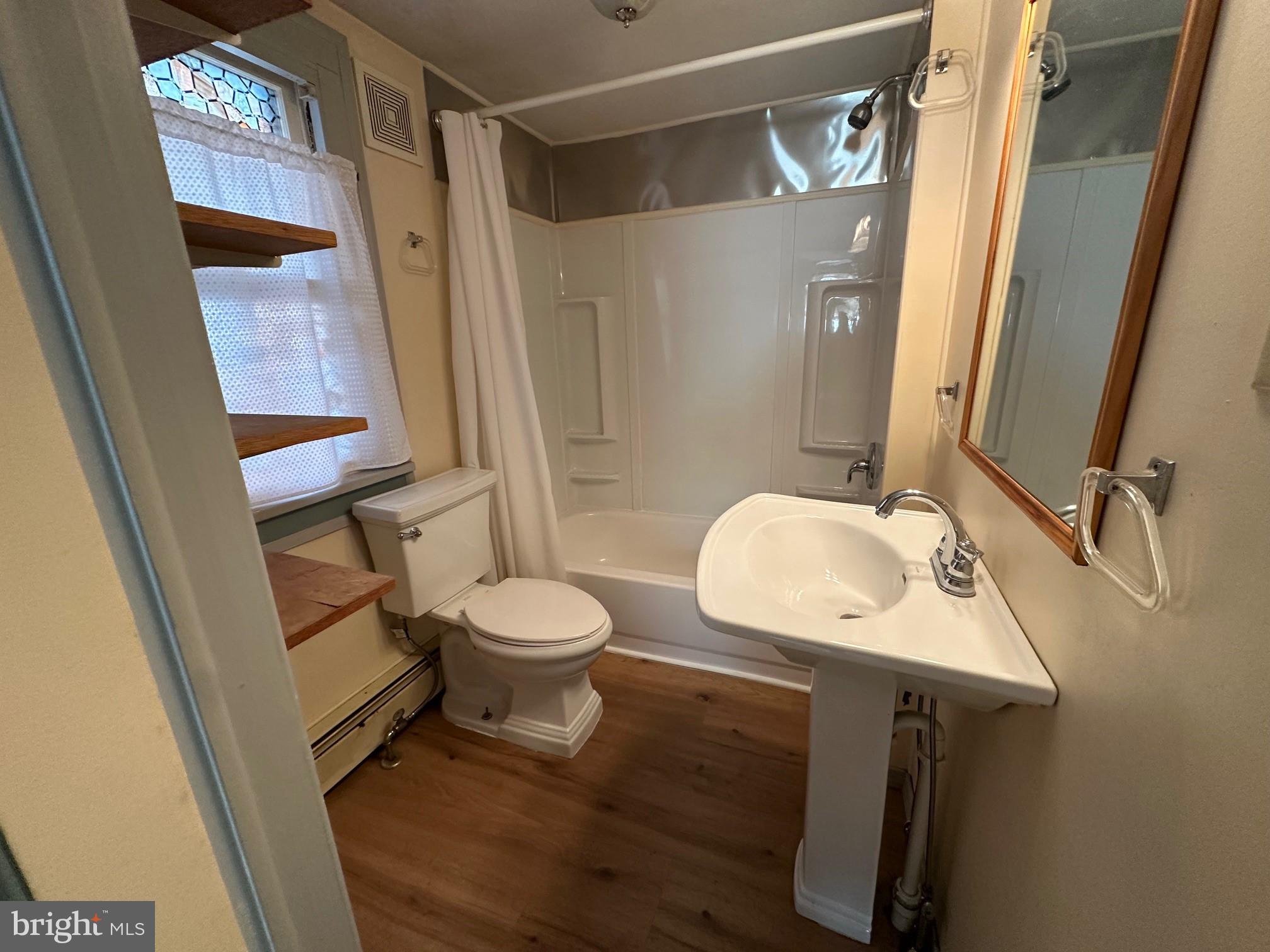 308 A Ash Street Delanco, NJ 08075 - Photo 7 of 11 a bathroom with a sink mirror toilet and shower
