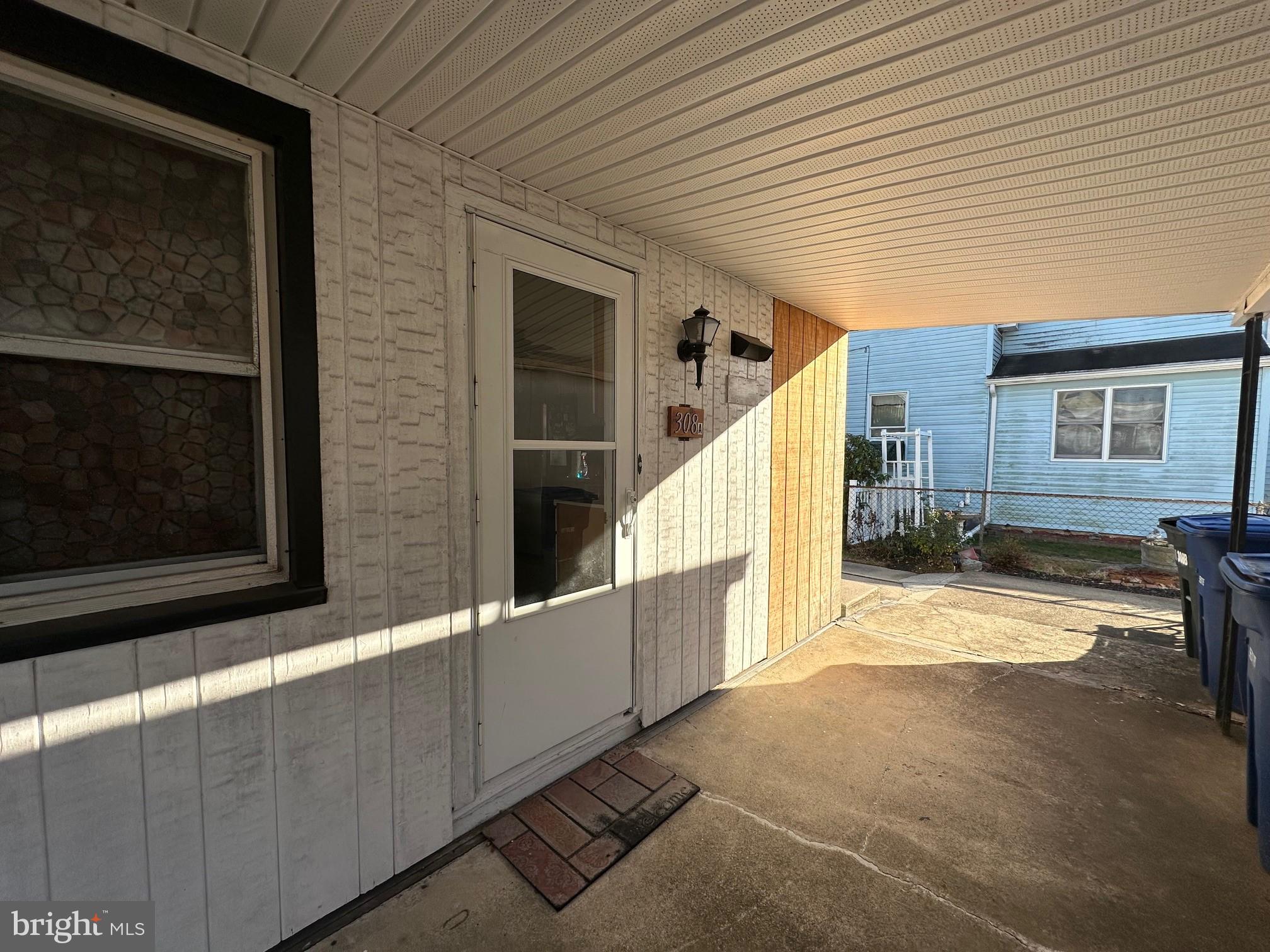 308 A Ash Street Delanco, NJ 08075 - Photo 8 of 11 a view of a porch with wooden floor and stairs