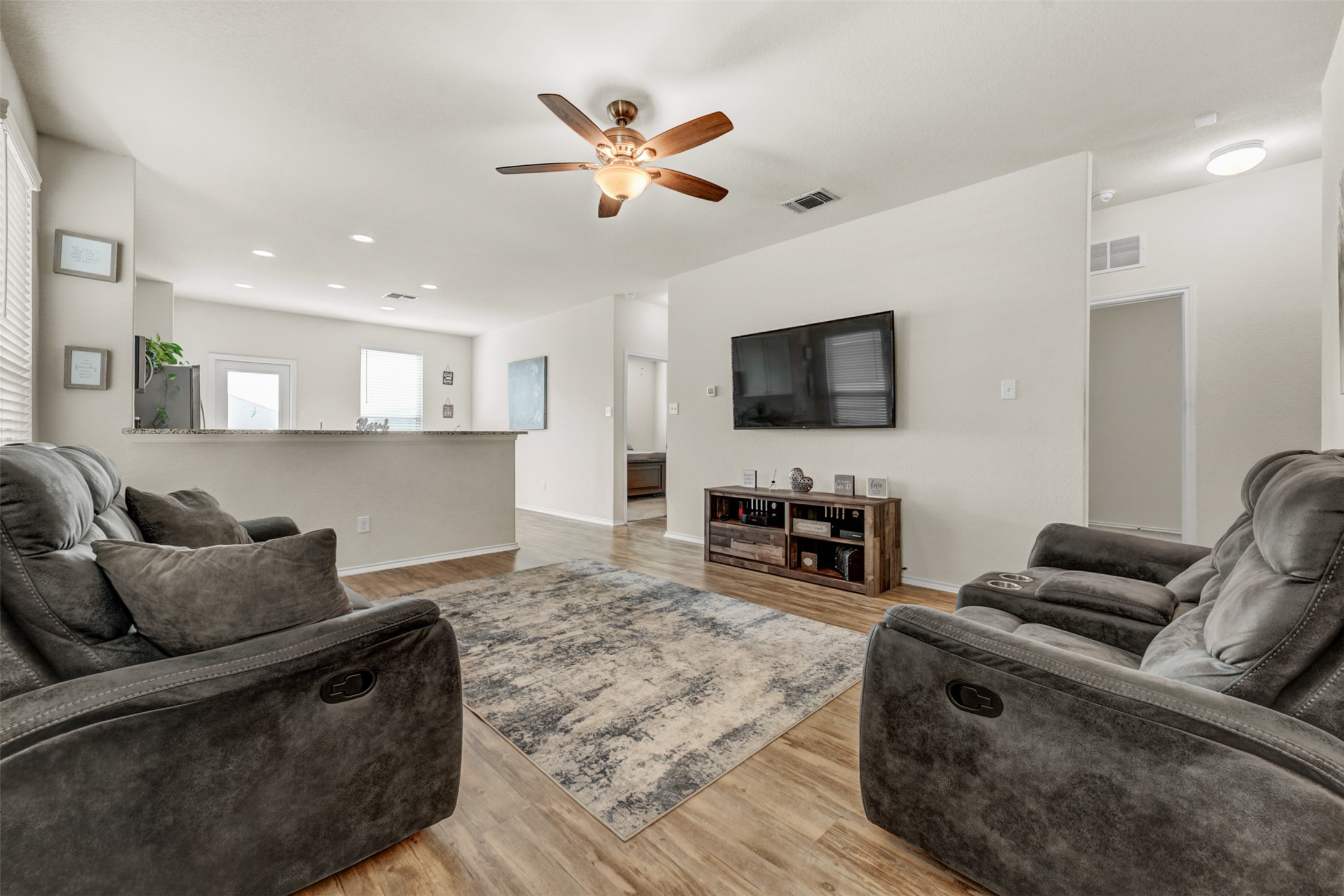 213 Ibis Falls Loop Jarrell, TX 76537 - Photo 37 of 37 An inviting gathering space features an open floorplan and a ceiling fan.