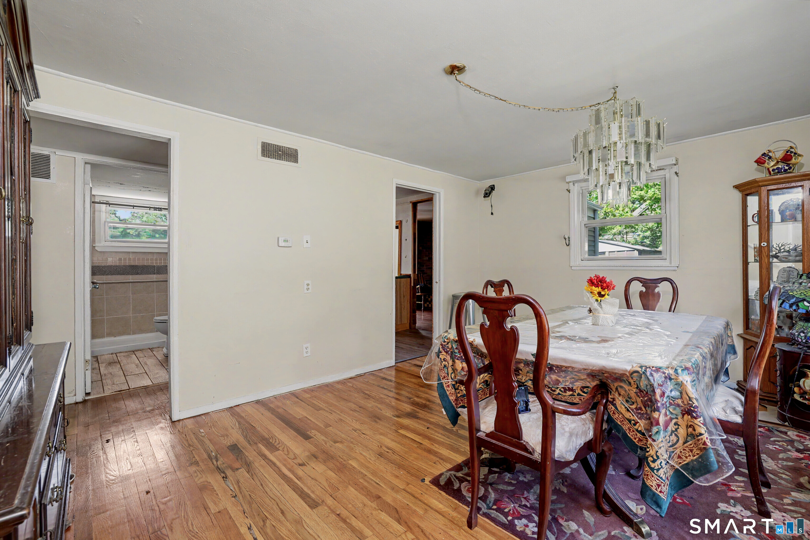 97 Boothbay Street Bloomfield, CT 06002 - Photo 13 of 33 a dining room with furniture and window