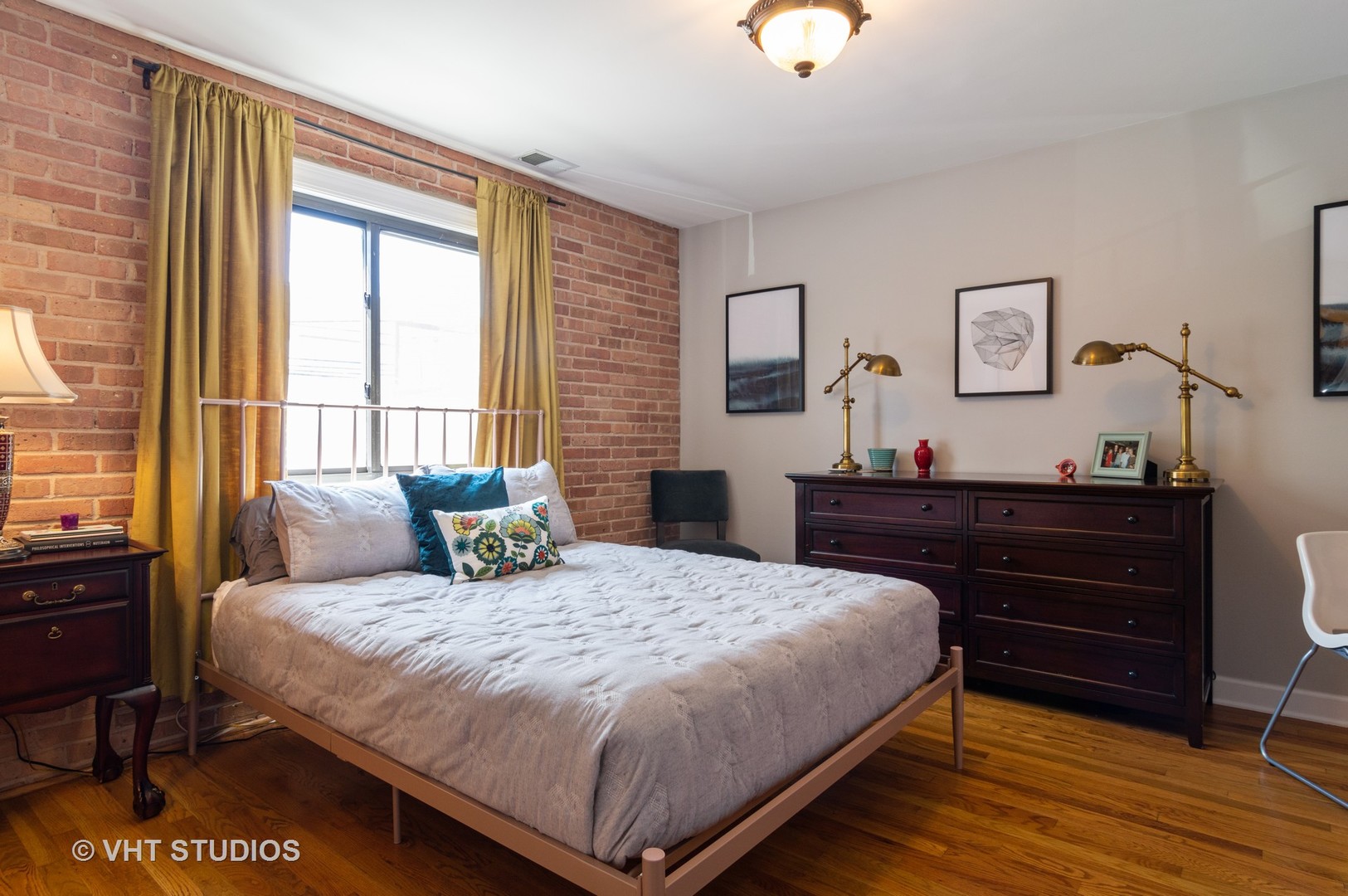 711 West Melrose Street, Unit B2 Chicago, IL 60657 - Photo 12 of 22 a bedroom with a bed and wooden floor