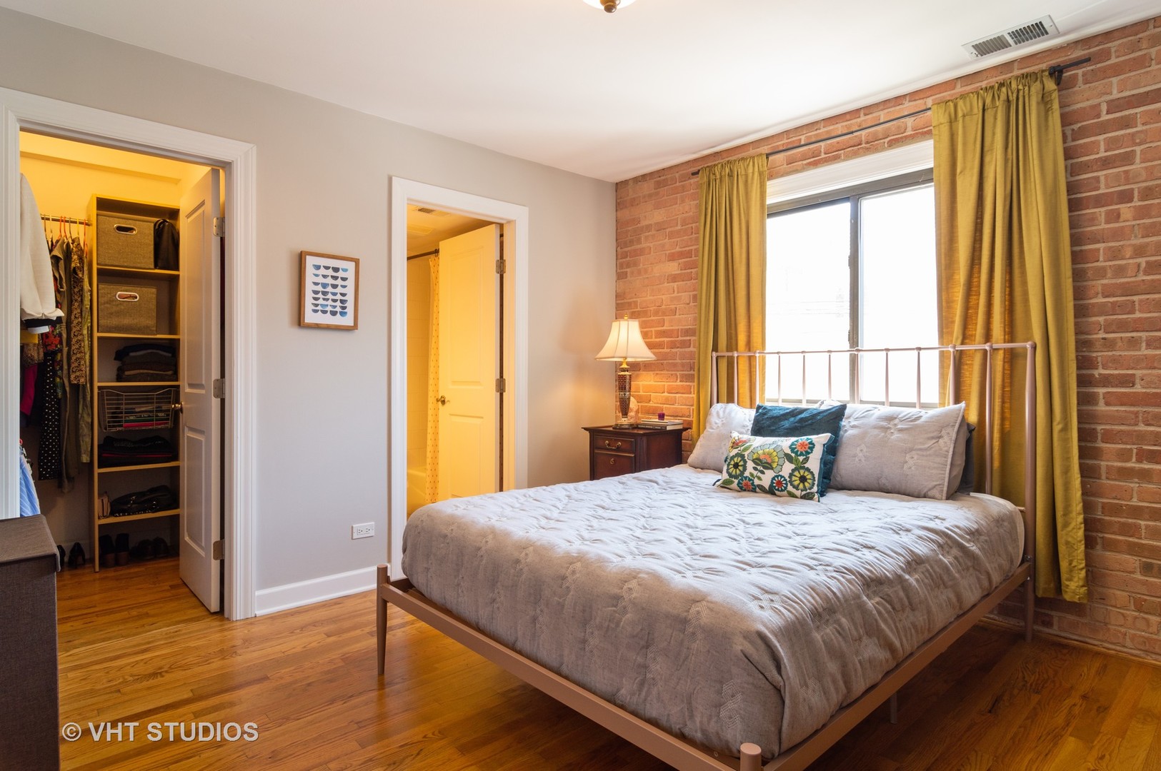 711 West Melrose Street, Unit B2 Chicago, IL 60657 - Photo 13 of 22 a bedroom with a bed and wooden floor