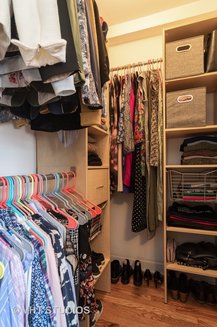 711 West Melrose Street, Unit B2 Chicago, IL 60657 - Photo 15 of 22 a view of walk in closet with clothes and shoes