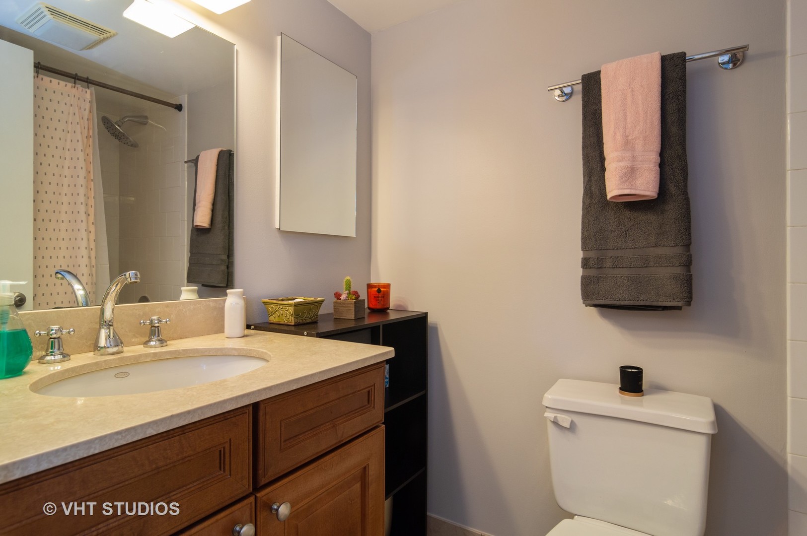 711 West Melrose Street, Unit B2 Chicago, IL 60657 - Photo 16 of 22 a bathroom with a sink toilet and mirror