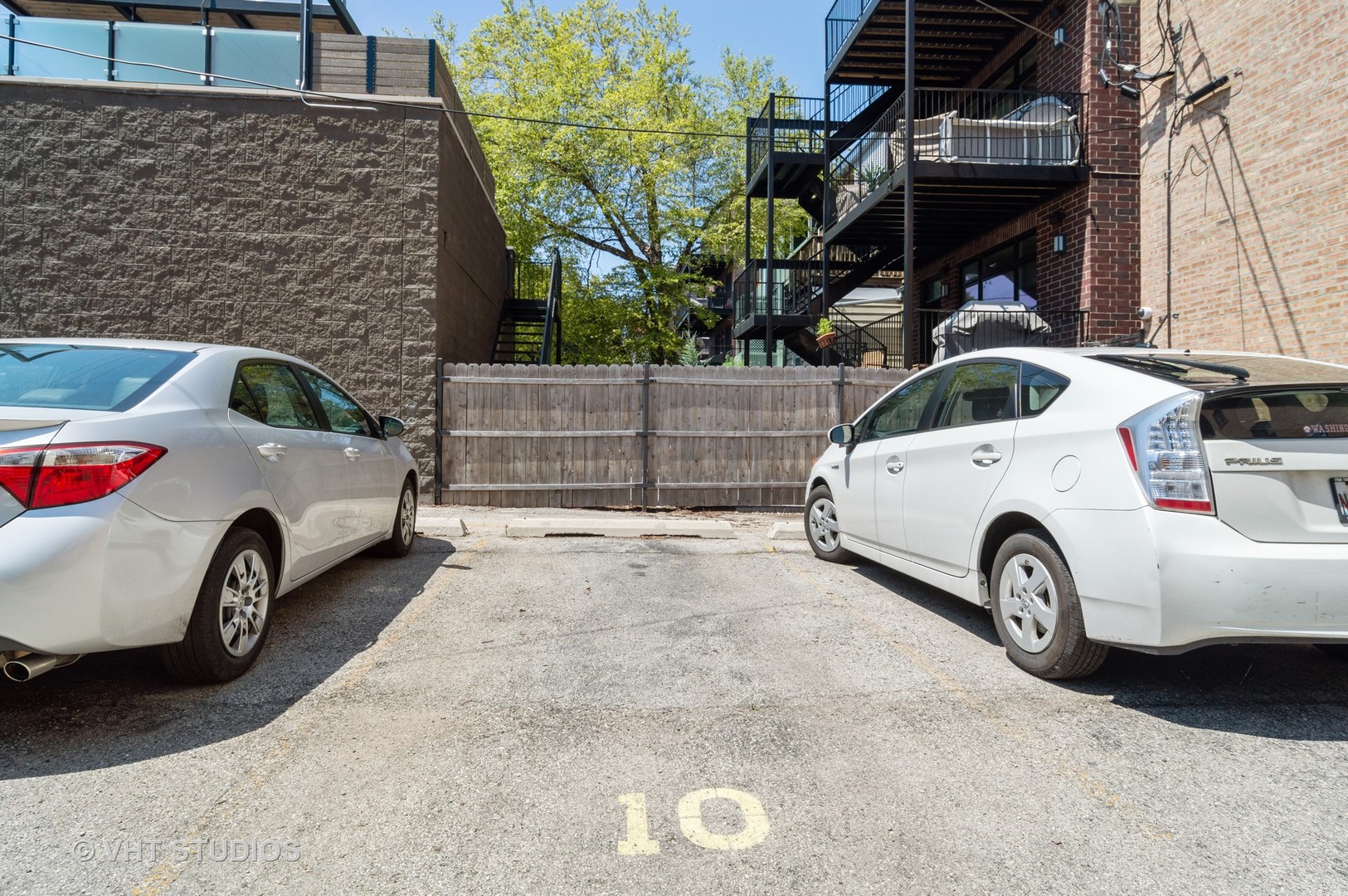 711 West Melrose Street, Unit B2 Chicago, IL 60657 - Photo 21 of 22 a view of a car parked in front of a house
