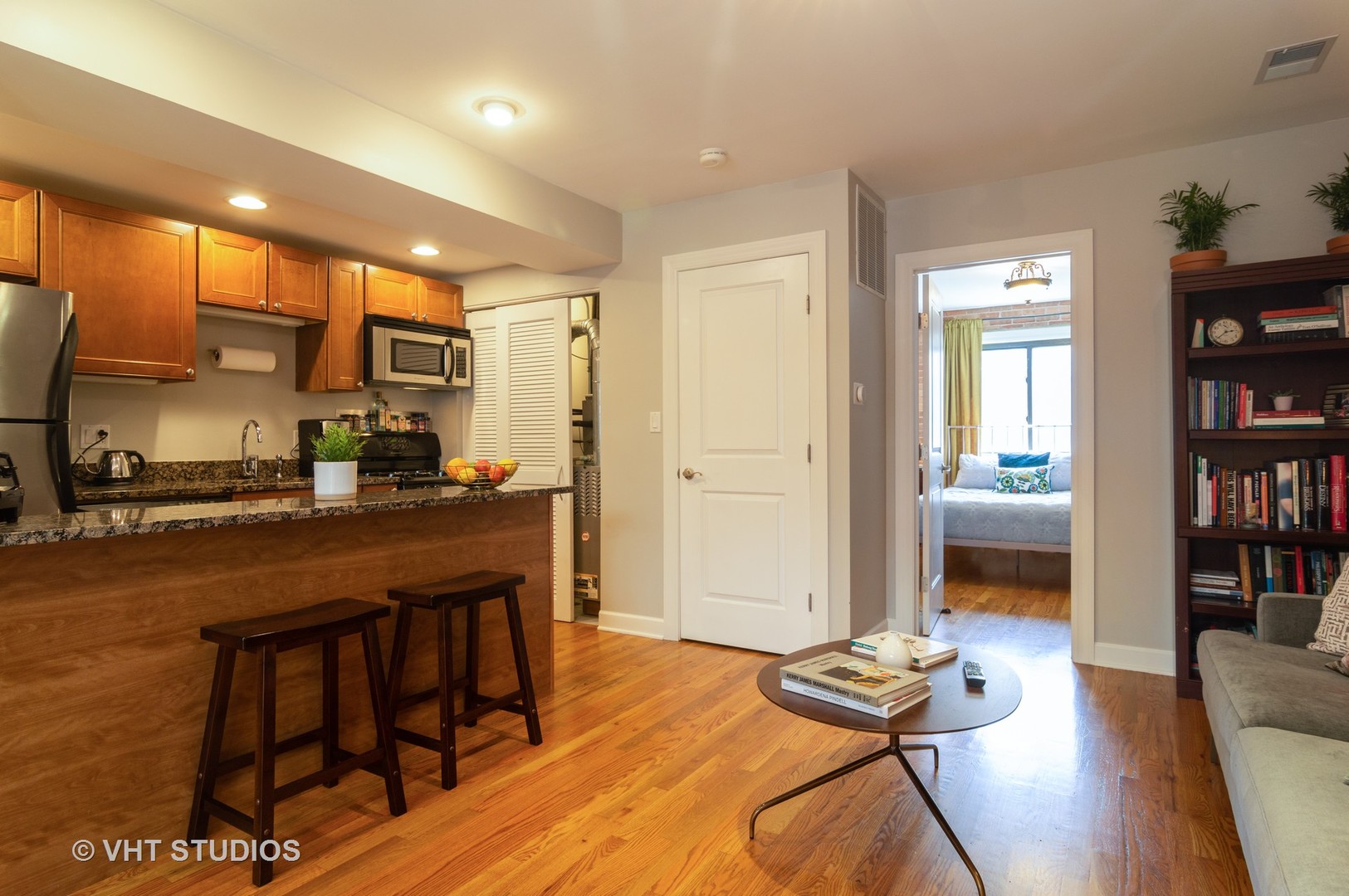 711 West Melrose Street, Unit B2 Chicago, IL 60657 - Photo 7 of 22 a living room with furniture a flat screen tv and a table