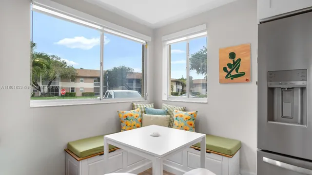 a kitchen with stainless steel appliances a sink stove and cabinets
