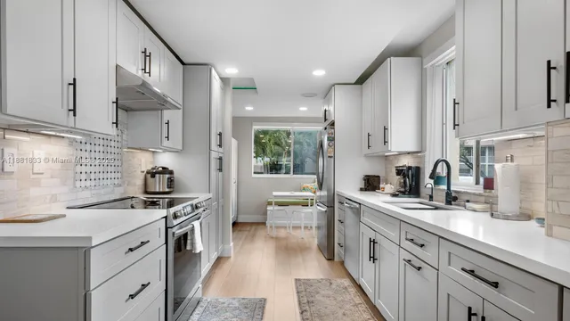 a kitchen with a stove and cabinets