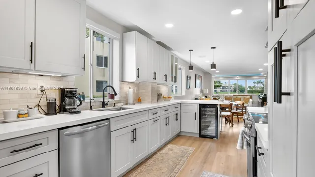 a bathroom with a sink vanity mirror and toilet