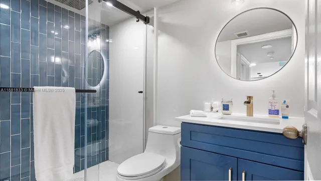 a bedroom with bed and wooden floor