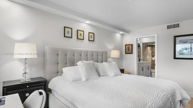 a bathroom with a double vanity sink toilet mirror and shower