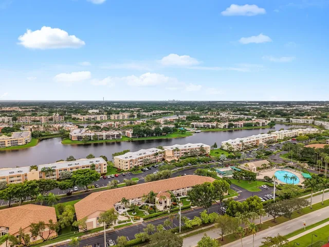 an aerial view of city and lake