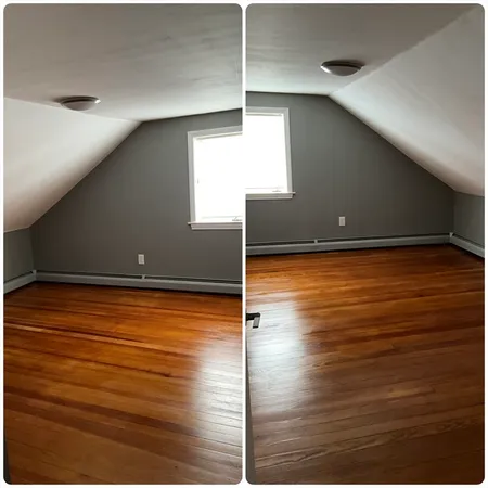 a view of a room with wooden floor