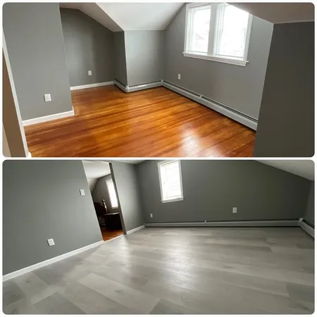 a view of an empty room with windows