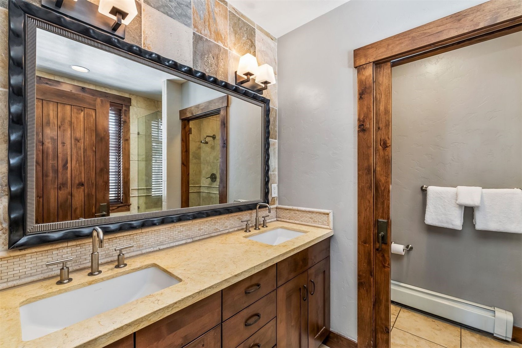 600 Columbine Road, Unit 5305 Breckenridge, CO 80424 - Photo 12 of 36 a bathroom with a sink and a mirror