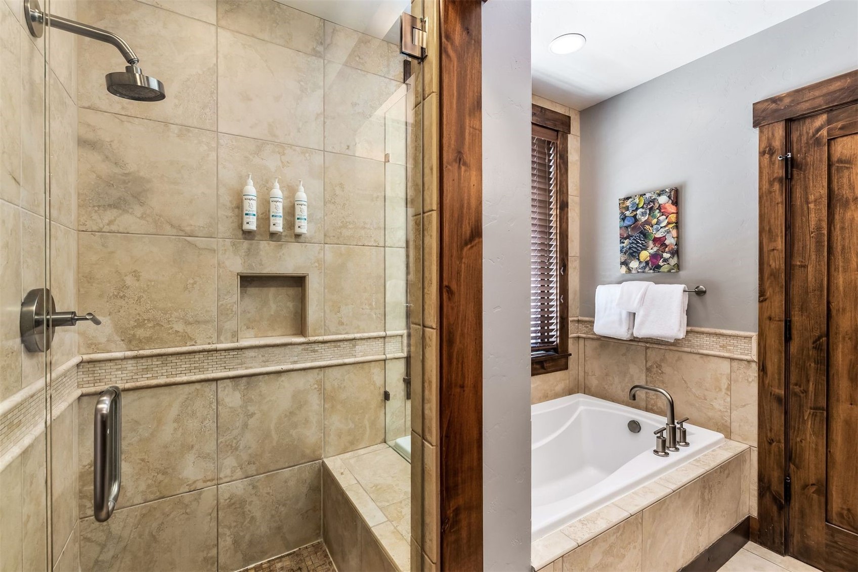 600 Columbine Road, Unit 5305 Breckenridge, CO 80424 - Photo 13 of 36 a bathroom with a tub a sink and shower