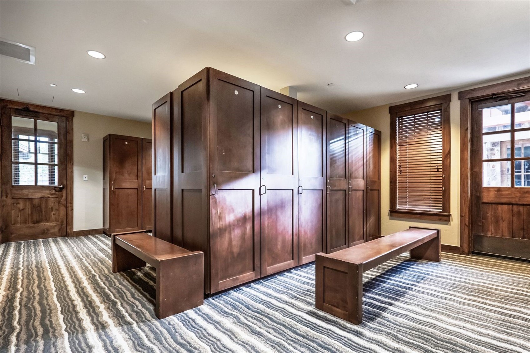 600 Columbine Road, Unit 5305 Breckenridge, CO 80424 - Photo 23 of 36 a view of a hallway with wooden floor and staircase