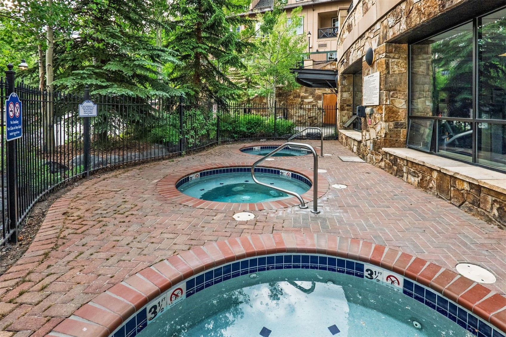 600 Columbine Road, Unit 5305 Breckenridge, CO 80424 - Photo 25 of 36 a front view of a house with garden