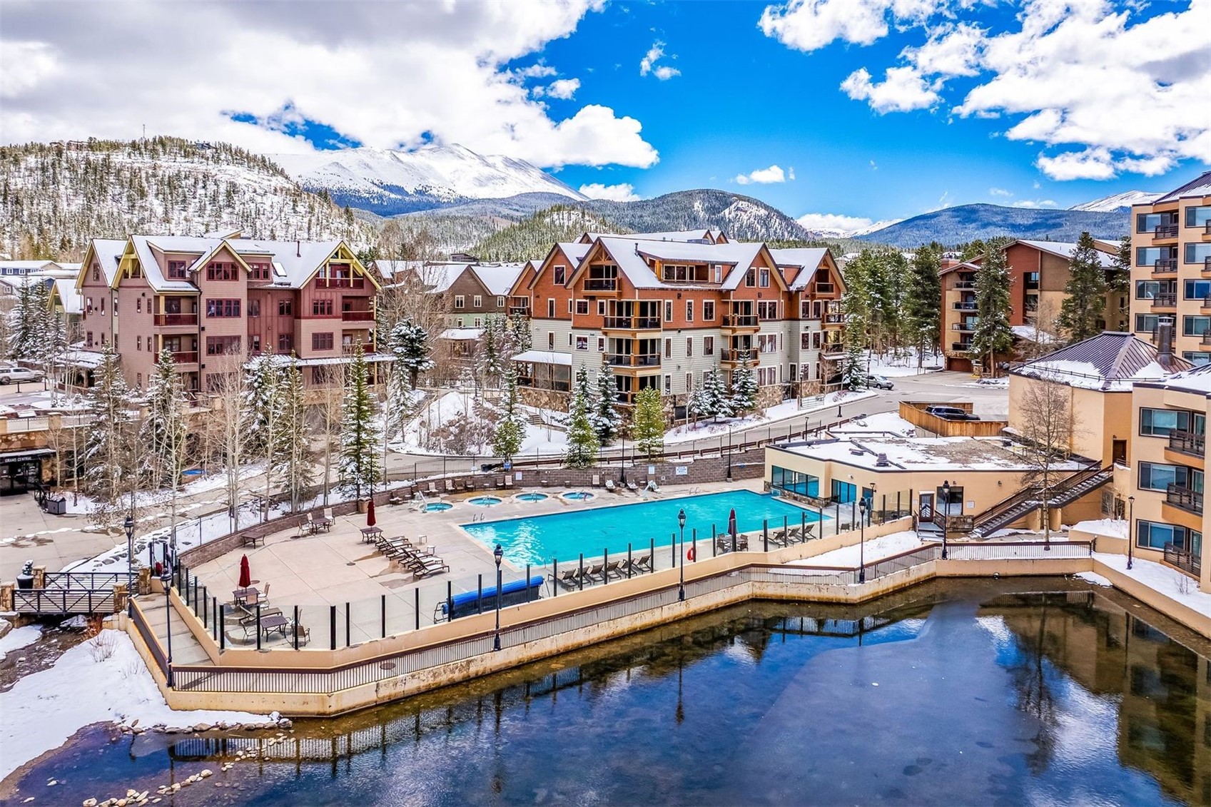 600 Columbine Road, Unit 5305 Breckenridge, CO 80424 - Photo 27 of 36 a view of a swimming pool with a lounge chairs