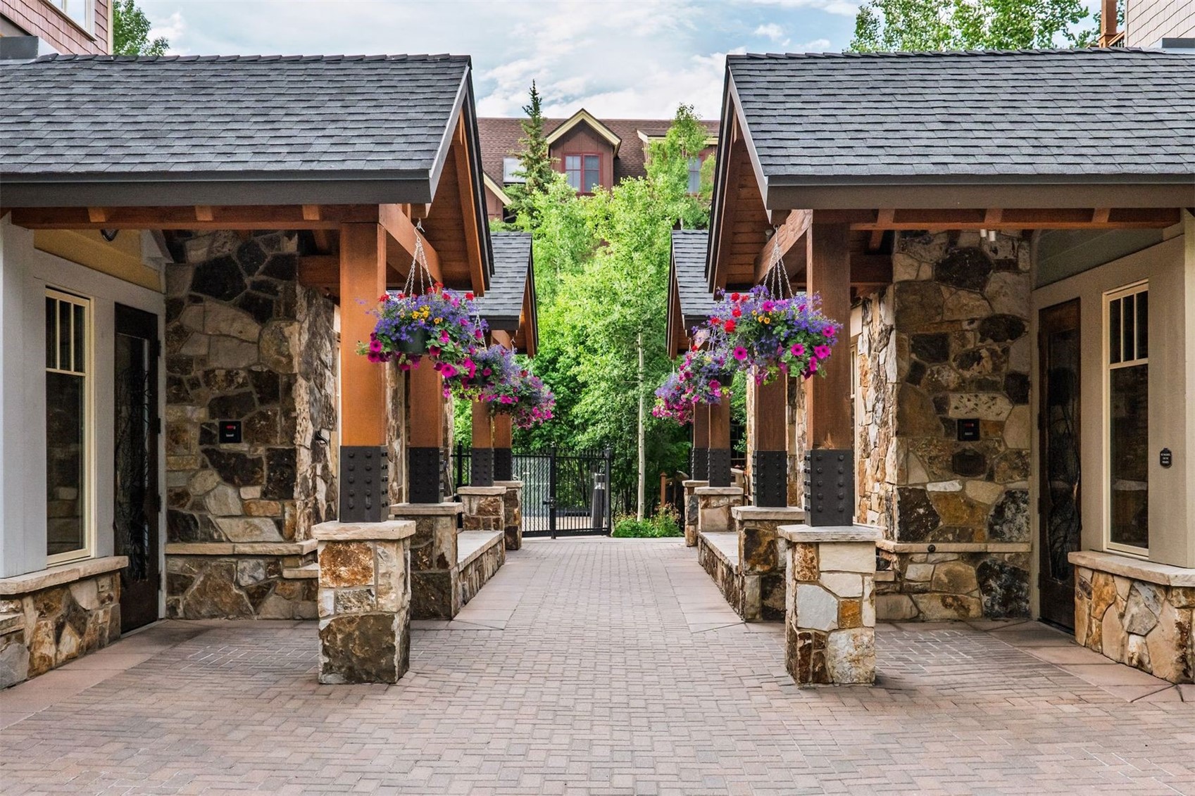 600 Columbine Road, Unit 5305 Breckenridge, CO 80424 - Photo 34 of 36 a view of a patio with table and chairs potted plants and a chair