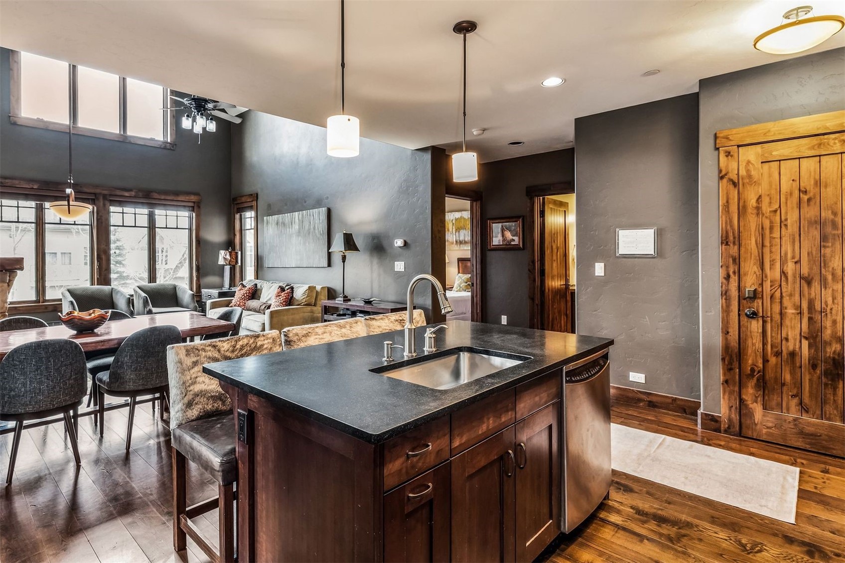 600 Columbine Road, Unit 5305 Breckenridge, CO 80424 - Photo 5 of 36 a kitchen with stainless steel appliances granite countertop a sink a stove and a wooden floors
