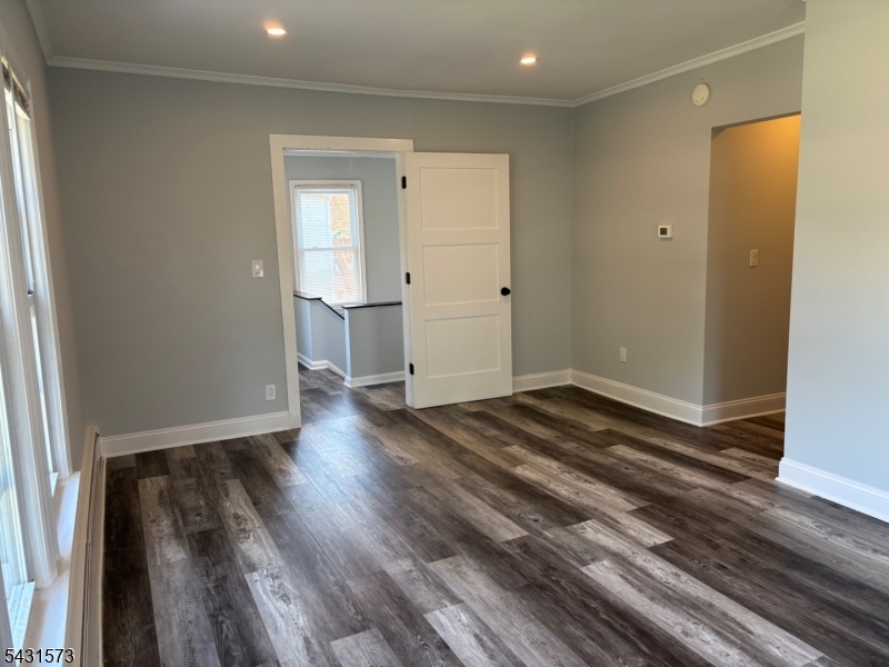 358 Woodland Road, Unit 2 Madison, NJ 07940 - Photo 12 of 50 a view of a room with wooden floor and a window