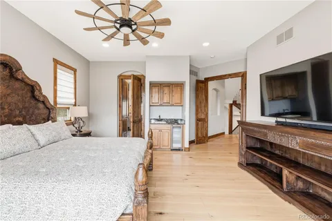 a bedroom with a bed and a fireplace