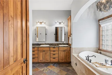 a bathroom with a sink a mirror and a shower